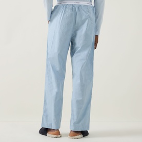Model wearing Calvin Klein Logo Gingham Pyjama Bottoms in Ballad Blue, straight-leg fit, elasticated waistband, gingham print, rear view