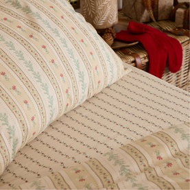 Foxford Rose Floral Fitted Sheet Cream in multi, 100% cotton with delicate stripe and floral print detailing, styled on a bed