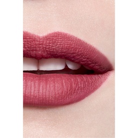 CHANEL Rouge Allure Velvet Luminous Matte Lip Colour worn on lips, shown in a dusty rose-pink matte finish close-up