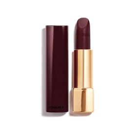 CHANEL Rouge Allure Velvet Luminous Matte Lip Colour lipstick in deep burgundy-plum with gold case, cap removed to show bullet