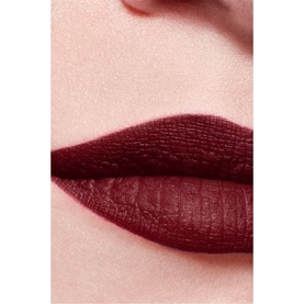 Close-up of lips wearing CHANEL Rouge Allure Velvet Luminous Matte Lip Colour in a deep burgundy-red matte finish
