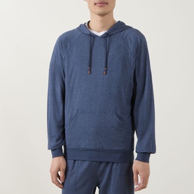 Model wearing Paul Smith Access blue modal blend hoodie with kangaroo pocket and drawstring hood, styled with matching blue joggers.