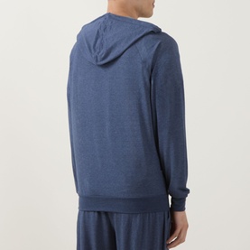 Model wearing Paul Smith Access blue modal blend hoodie, rear view, styled with matching blue lounge shorts.