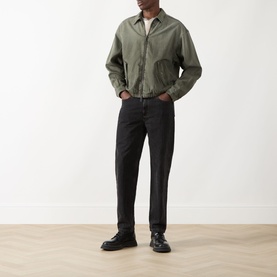Model wearing Seven Jeans Sunfaded Moss Casual Jacket, styled with black trousers and black leather shoes.