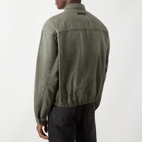 Model wearing Seven Jeans Casual Jacket in Sunfaded Moss, rear view, cotton-lyocell blend with elasticated hem and small logo patch