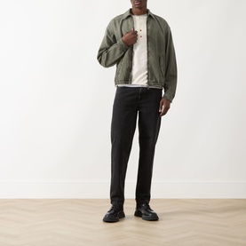 Model wearing Seven Jeans Sunfaded Moss Casual Jacket styled with white tee, black jeans and black chunky boots.