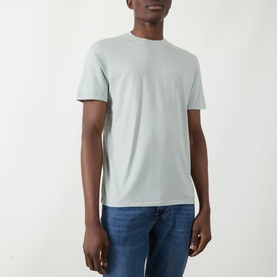 Model wearing Seven Jeans Dusty Blue Crew Neck T-Shirt in lyocell-cotton blend, styled with blue jeans.