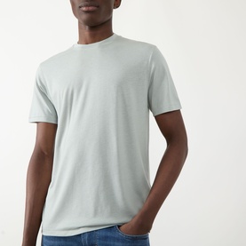 Model wearing Seven Jeans Dusty Blue Crew Neck T-Shirt in lyocell-cotton blend, styled with blue jeans