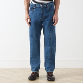 Model wearing Seven Jeans 3049 Straight Jeans in Kingfisher blue, styled with a striped top and brown boots