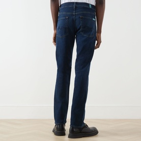 Model wearing Seven Jeans Straight 3049 Jeans in Indigo Minty, rear view, styled with black leather shoes