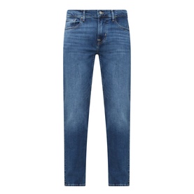 Seven Jeans Slimmy Mid-Rise Tapered Jeans in Signal blue with whiskering, faded details, five-pocket style and zip fly fastening