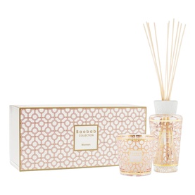 Baobab Collection gift set with reed diffuser and candle in blush pink and gold geometric-patterned vessels, with matching gift box
