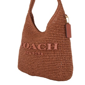 Coach Brooklyn 28 Woven Shoulder Bag in clay paper straw with embossed logo lettering, fixed strap, and gold-tone branded swingtag