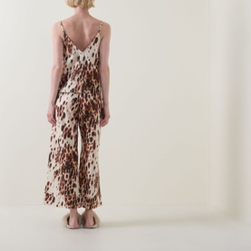 Model wearing Desmond & Dempsey Leopard Brown Cami & Wide-Leg Bottoms Pyjama Set, rear view showing V-back and cropped wide-leg trousers