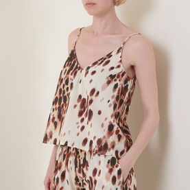 Model wearing Desmond & Dempsey Leopard Brown Cami & Wide-Leg Pyjama Set; V-neck cami with narrow straps styled with matching wide-leg bottoms