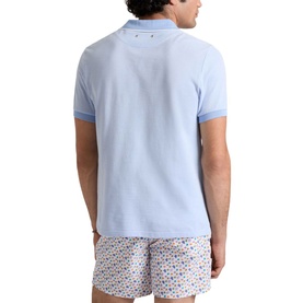 Model wearing Vilebrequin Regular Polo in Cloudy blue, back view, styled with printed swim shorts