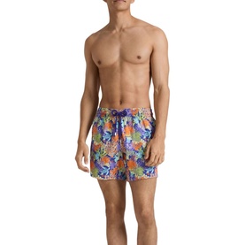 Model wearing Vilebrequin swim shorts in Versailles multicolour tropical print with navy drawstring waistband