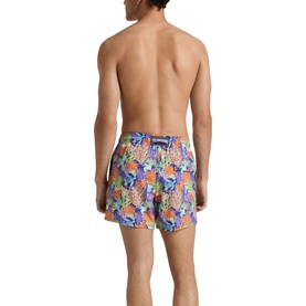 Model wearing Vilebrequin swim shorts in Versailles multicolour floral and coral print, shown from the back with drawstring waist.