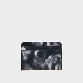 Christian Louboutin card holder in black and white abstract floral print, slim flat profile with card slot detail