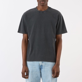 Model wearing Edwin Axiom Logo T-Shirt in dark grey, crew neck, short sleeves, garment-dyed finish, styled with light blue jeans.