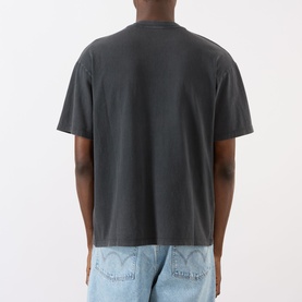 Model wearing Edwin Axiom Logo T-Shirt in dark grey, rear view, relaxed fit with straight hem, styled with light blue denim jeans.