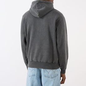 Model wearing Edwin Axiom Logo Hoodie in dark grey, back view, styled with light blue jeans.