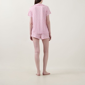 Model wearing Stripe & Stare Cherry Short Pyjama Set in Cherry Baby, rear view, pink cherry-print short-sleeve shirt and shorts