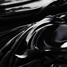YSL Lash Latex Mascara in 01 Black, glossy liquid black texture close-up showcasing the formula's high-shine finish