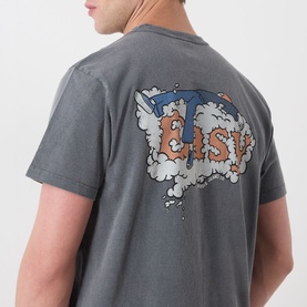 Model wearing Nudie Jeans Roy Take It Easy Logo T-Shirt in Antracite, showing back graphic print with foam cloud and logo design.