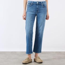 Model wearing Paige Mason Mid-Rise Ankle Straight Leg Jeans in Monaco Mist blue denim, styled with tan loafers.
