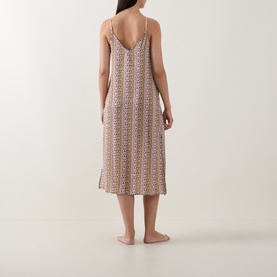 Model wearing DKNY Dusky Green Logo Stripe Chemise, midi length with V-back and thin straps, shown from behind
