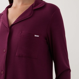 Model wearing DKNY Maroon Banner pyjama shirt, button-front with chest pocket and logo badge detail, long sleeves.
