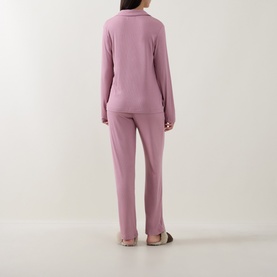 Model wearing DKNY Notched Collar Long-Sleeved Pyjama Set in Dusty Mauve, back view, straight-leg trousers and long-sleeved top