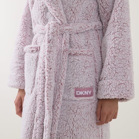 Model wearing DKNY Dusty Mauve Frosted Sherpa Robe, close-up of belted waist and DKNY branded patch detail