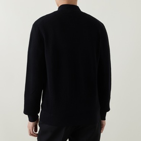 Model wearing Boss Black Casual Laconico Knitted Polo Cardigan in black, rear view showing dropped shoulders and ribbed trims.