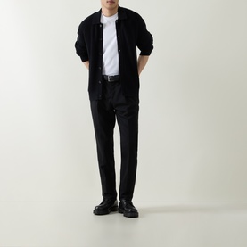 Model wearing Boss Black Casual Laconico Knitted Polo Cardigan in black, styled with white tee, black tailored trousers and black leather shoes.