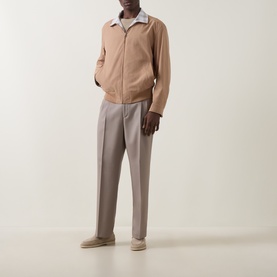 Model wearing Boss Black Casual Medium Beige casual jacket, styled with light grey trousers and beige loafers.