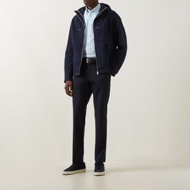 Model wearing Boss Black Casual dark blue casual jacket with hood, styled with light blue shirt, navy trousers and navy suede loafers