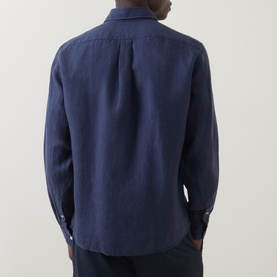 Model wearing Boss Black Casual Liam Logo Linen Shirt in dark blue, showing rear view with button-down collar and long sleeves