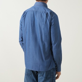 Model wearing Boss Black Casual Rob Denim Shirt in Open Blue, rear view, long sleeves, curved hemline, styled with blue jeans