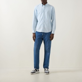 Model wearing Boss Black Casual Open Blue cotton casual shirt with blue jeans and grey trainers