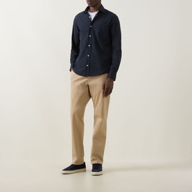 Model wearing Boss Black Casual dark blue cotton casual shirt with khaki chinos and navy canvas shoes