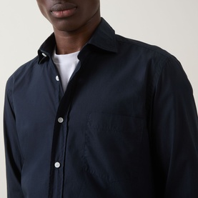 Model wearing Boss Black Casual dark blue cotton casual shirt with spread collar and chest pocket, styled with white crew-neck T-shirt