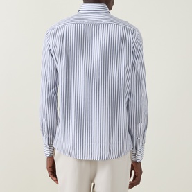 Model wearing Boss Black Casual Rob Striped Shirt in dark blue, rear view, showing long sleeves and curved hemline. Styled with cream trousers.