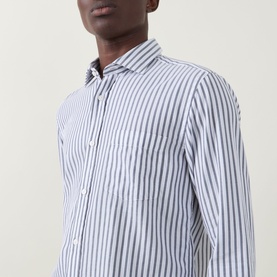 Model wearing Boss Black Casual Rob Striped Shirt in dark blue, close-up showing point collar, long sleeves, and vertical stripe pattern