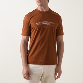 Model wearing Boss Black Casual medium brown cotton crew neck T-shirt with tonal car graphic print, styled with cream trousers.