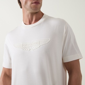 Model wearing Boss Black Casual Taut Logo T-Shirt in Open White, featuring tonal embossed logo detail on chest, crew neck and short sleeves.