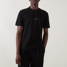 Model wearing Boss Black Casual Taut Logo T-Shirt in black with tonal car graphic print, crew neck, short sleeves, styled with black trousers
