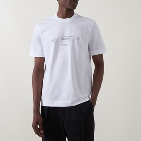 Model wearing Boss Black Casual Taut Logo T-Shirt in white with tonal car graphic print, crew neck, short sleeves, styled with dark trousers