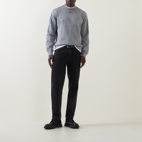 Model wearing Boss Black Casual Soleri Logo Sweatshirt in Open Grey with black jeans and black leather boots.